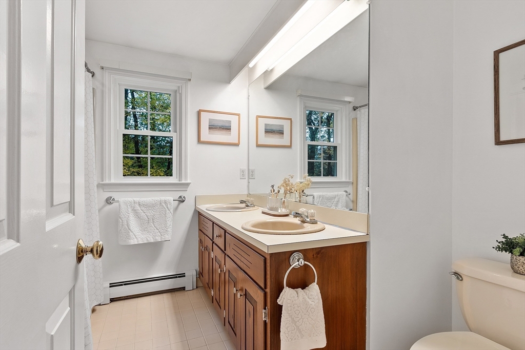 31 Herrick Road Boxford, MA 01921 - Photo 31 of 40 a bathroom with a sink toilet and tub