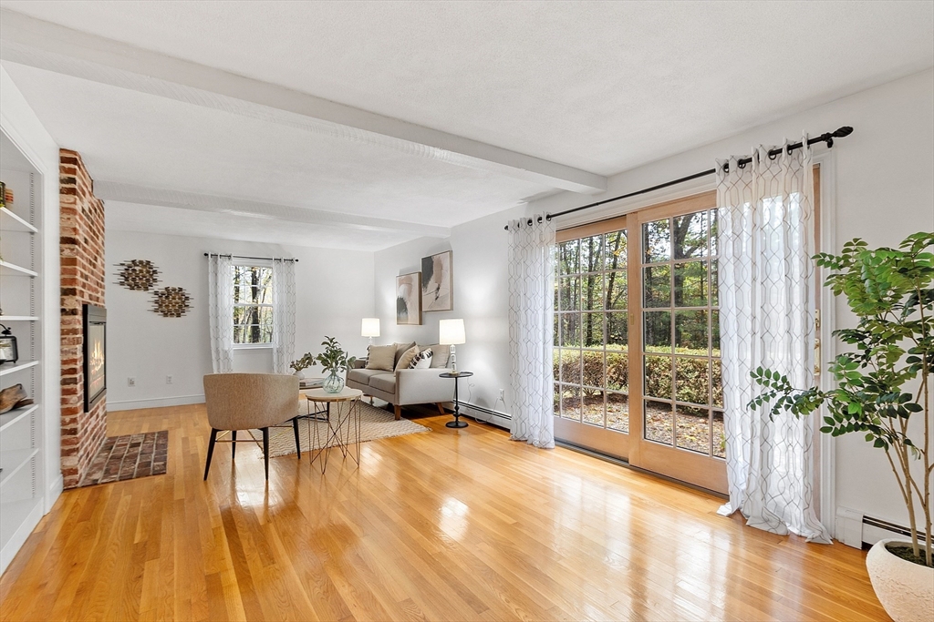 31 Herrick Road Boxford, MA 01921 - Photo 5 of 40 a living room with furniture and a large window with wooden floor