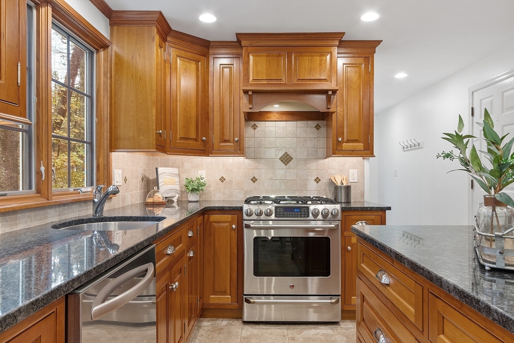 31 Herrick Road Boxford, MA 01921 - Photo 10 of 40 a kitchen with stainless steel appliances a stove a sink and a microwave