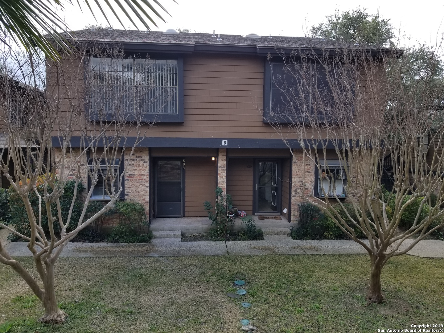 11815 Vance Jackson Road, Unit 605 San Antonio, TX 78230 - Photo 1 of 1 a view of a house with a yard and plants