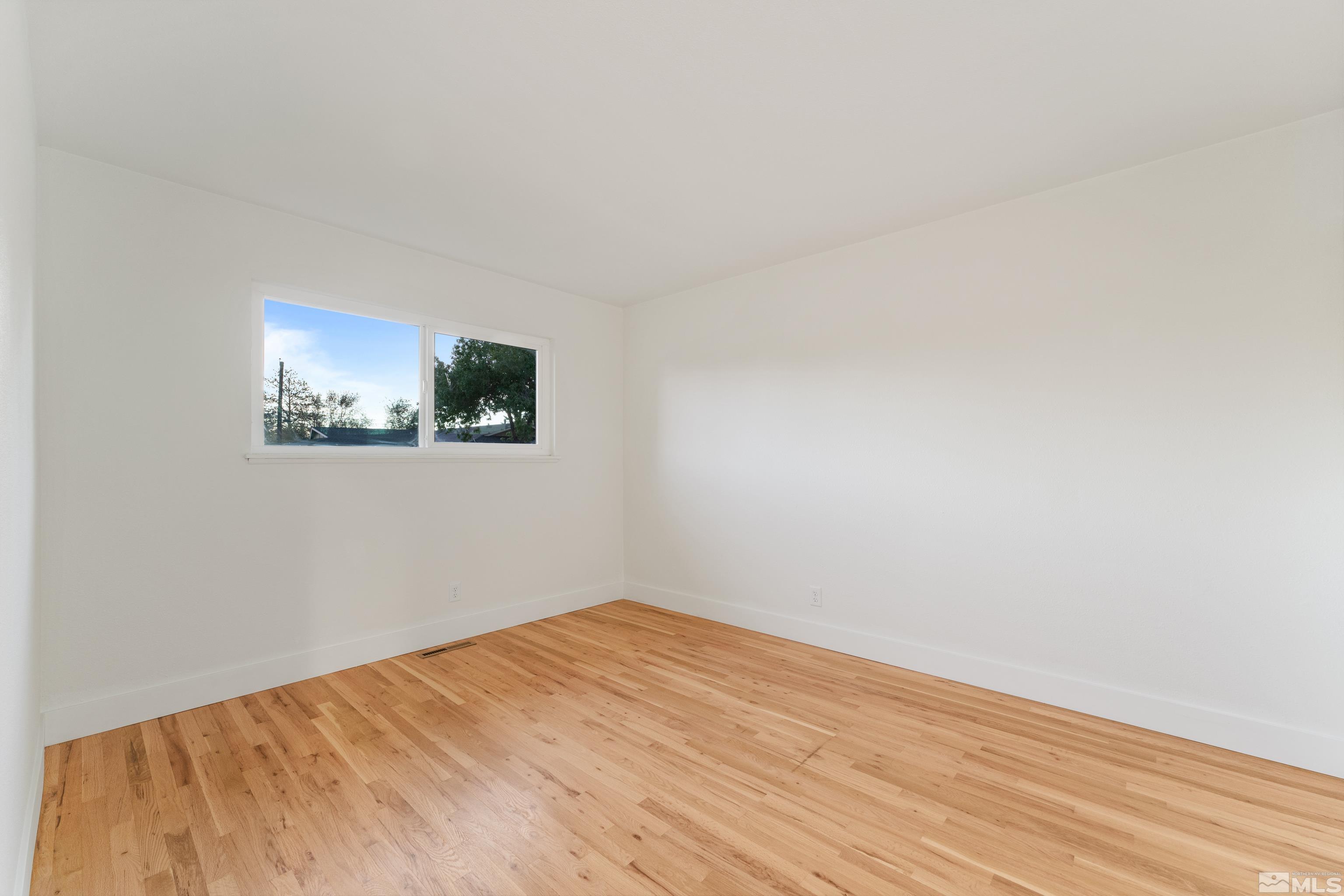 689 Beldon Way Reno, NV 89503 - Photo 13 of 30 a view of a room with wooden floor and white walls