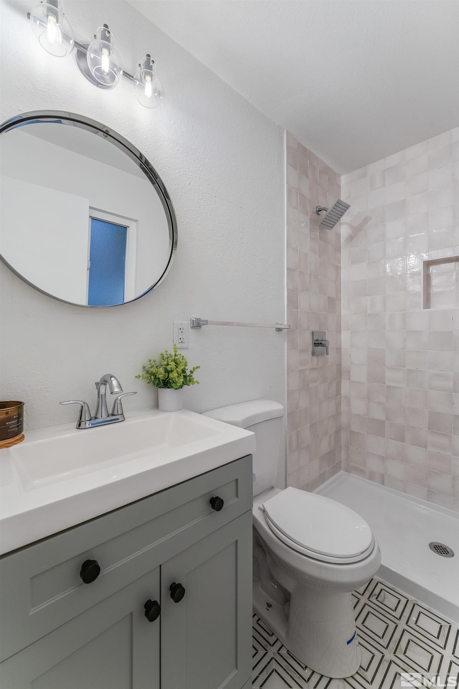 689 Beldon Way Reno, NV 89503 - Photo 15 of 30 a bathroom with a sink a toilet and shower
