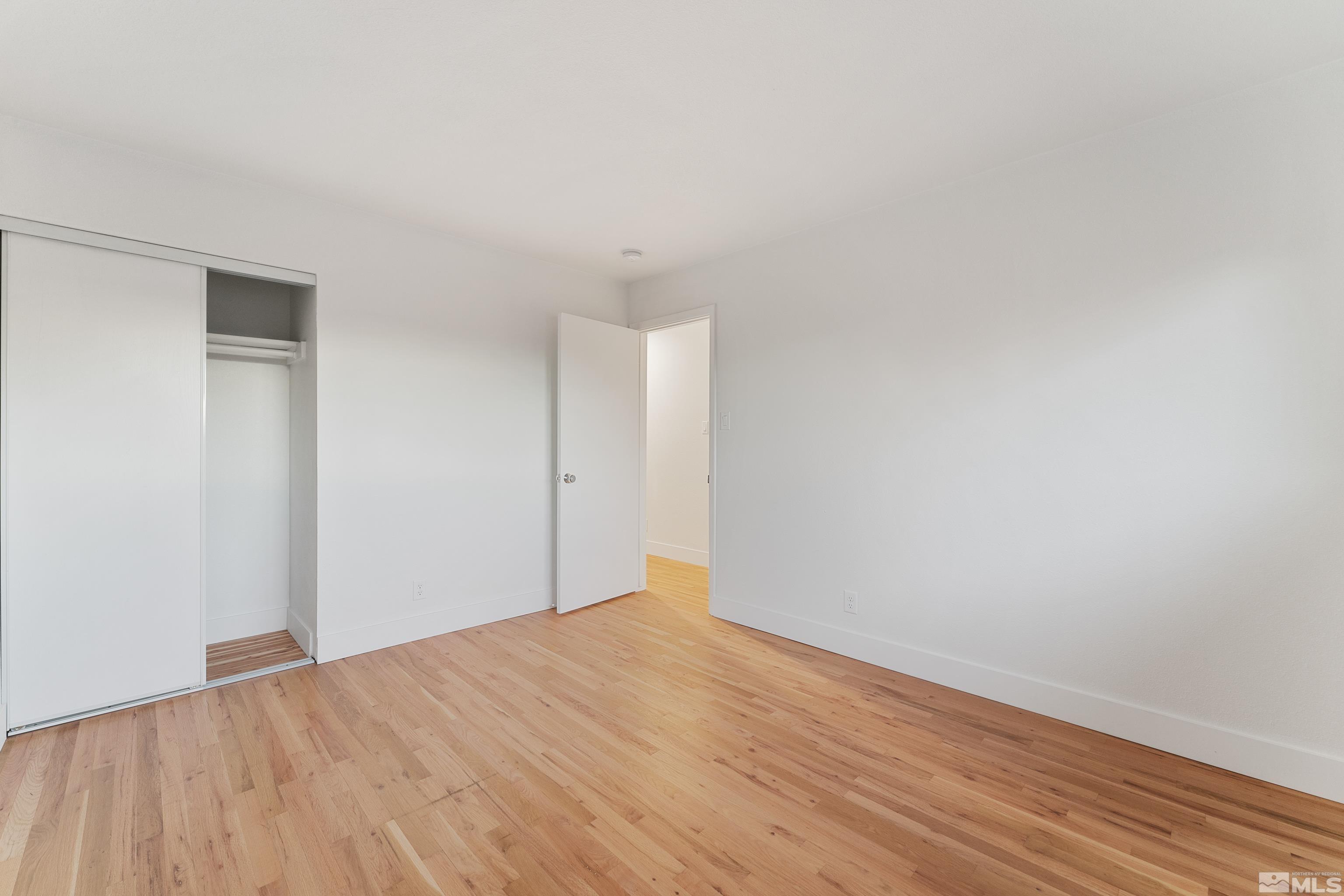 689 Beldon Way Reno, NV 89503 - Photo 17 of 30 a view of empty room with wooden floor
