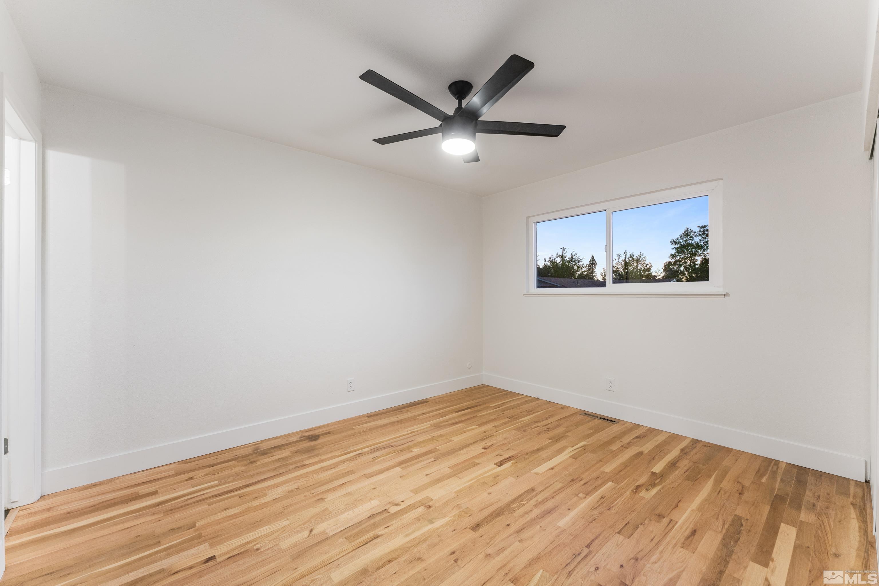 689 Beldon Way Reno, NV 89503 - Photo 18 of 30 a view of empty room with wooden floor