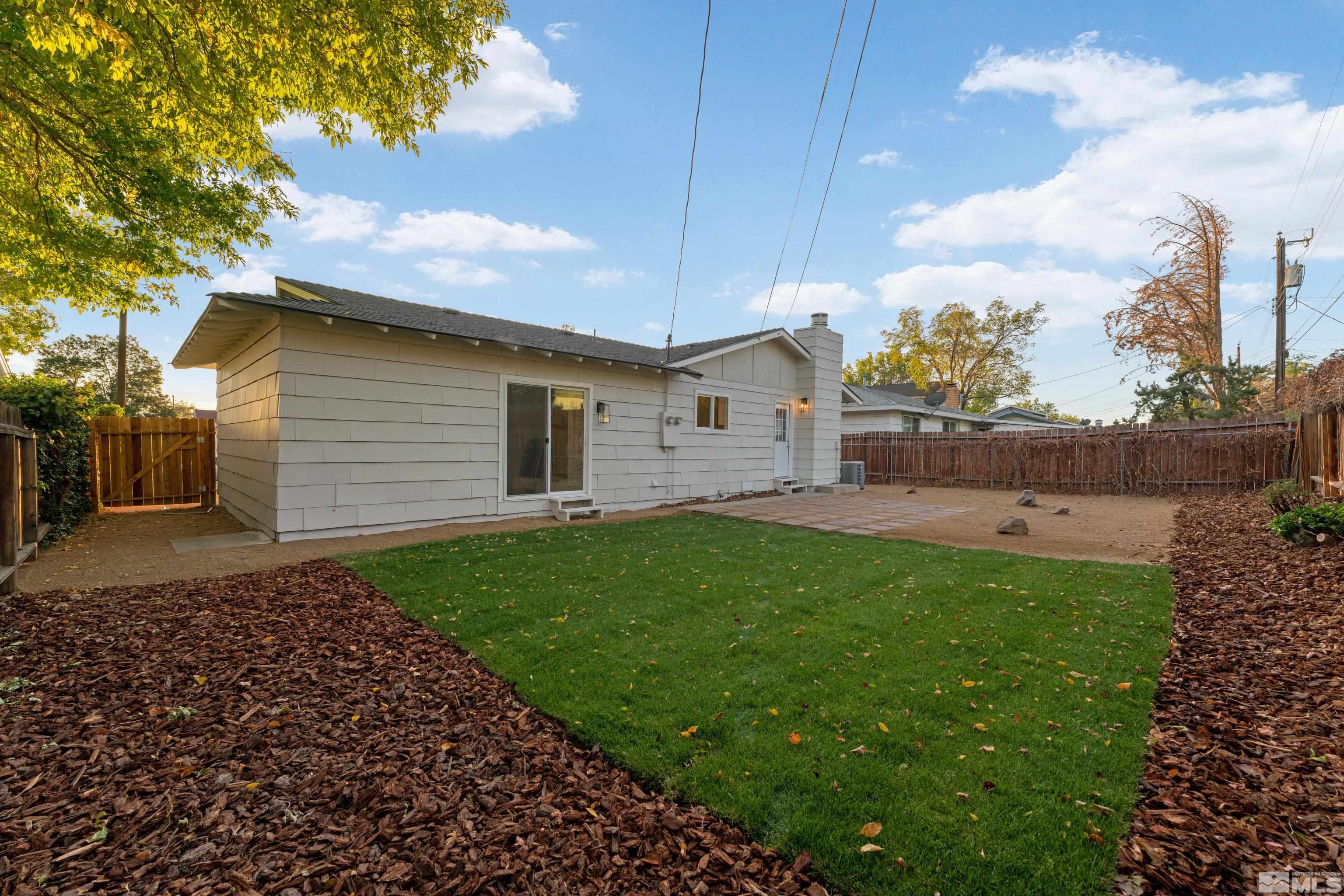 689 Beldon Way Reno, NV 89503 - Photo 26 of 30 a view of a backyard with plants and a garden