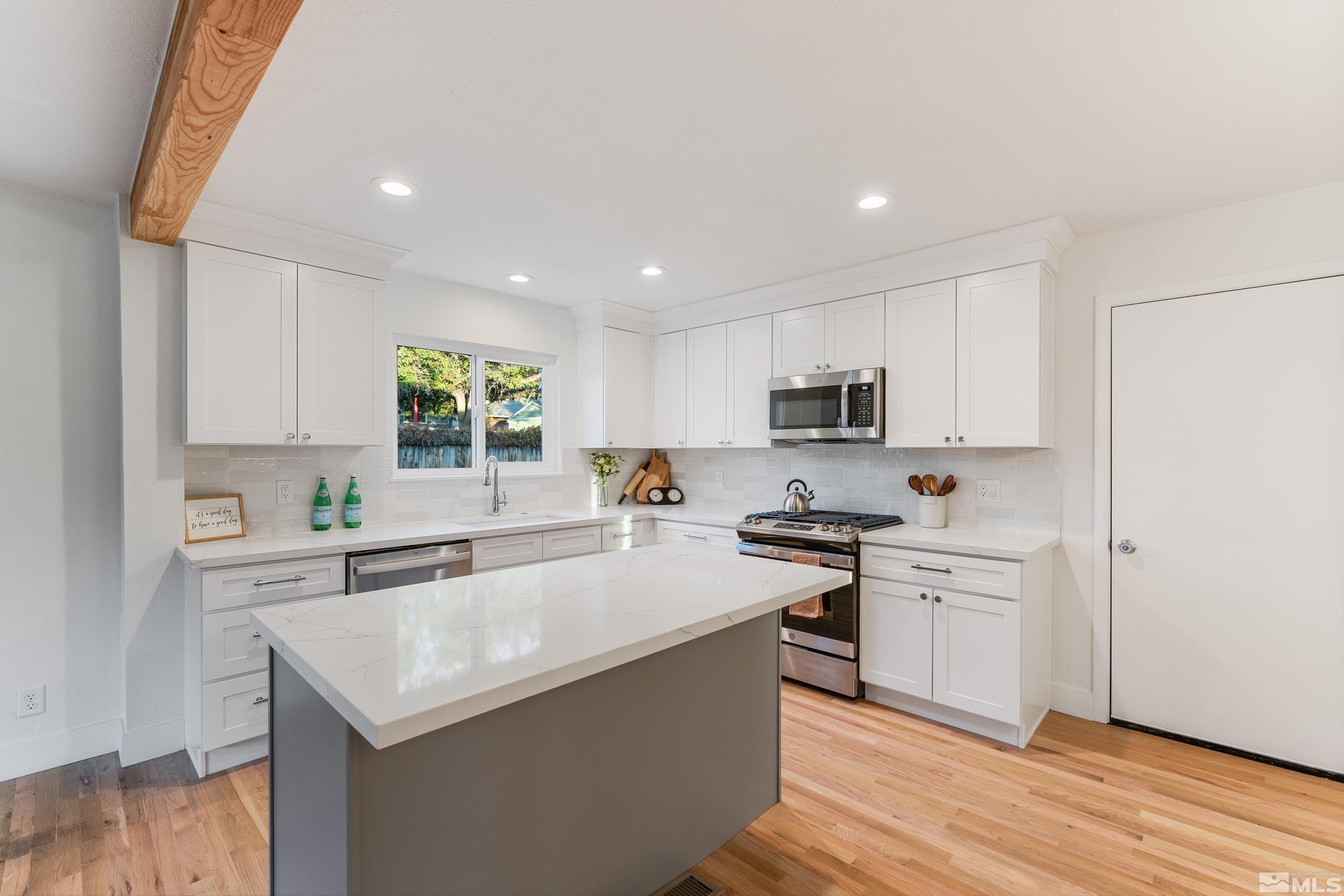 689 Beldon Way Reno, NV 89503 - Photo 5 of 30 a kitchen with stainless steel appliances a sink stove and refrigerator