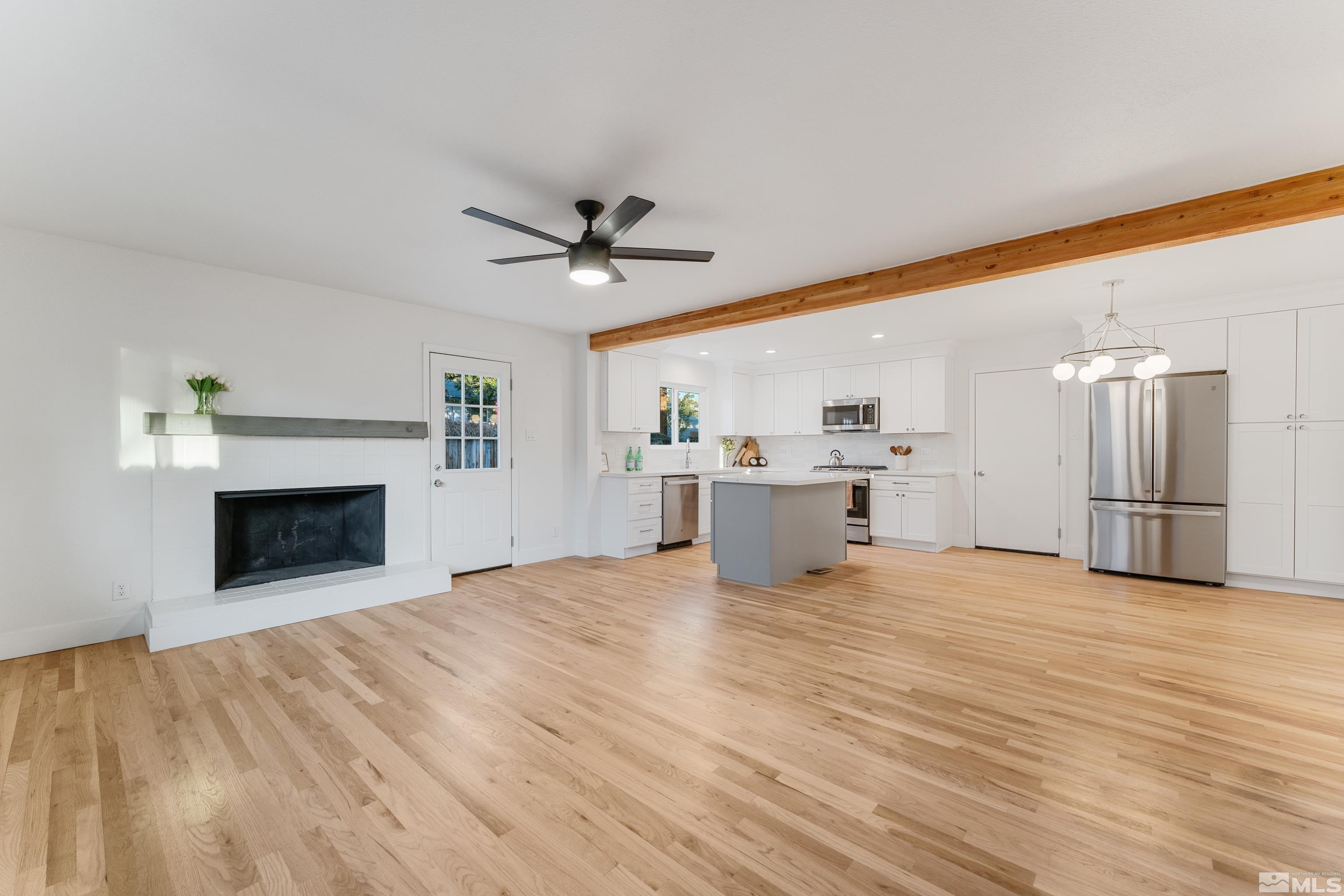 689 Beldon Way Reno, NV 89503 - Photo 6 of 30 a view of a kitchen with a sink and a fireplace