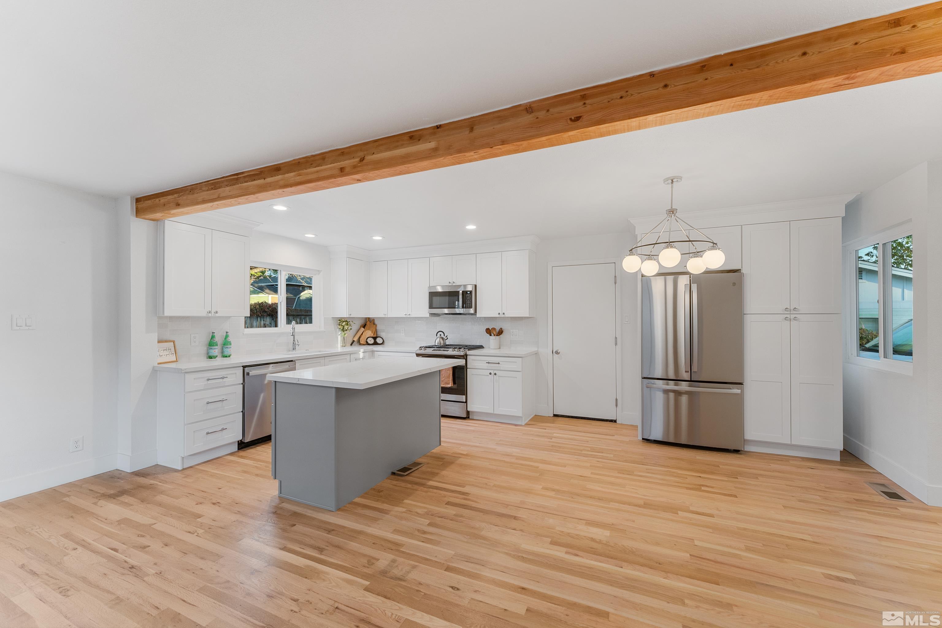 689 Beldon Way Reno, NV 89503 - Photo 8 of 30 a kitchen with a refrigerator and a sink