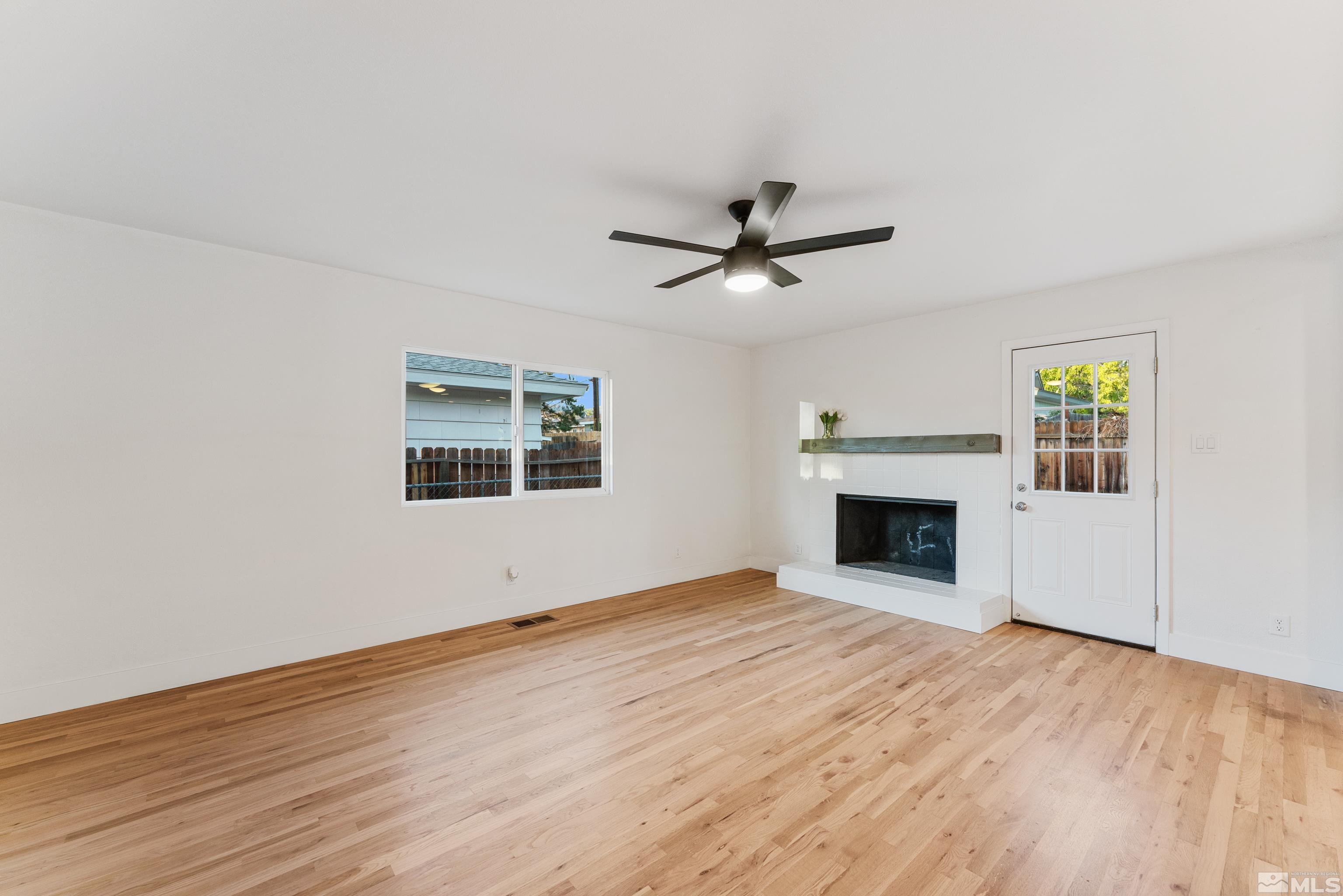689 Beldon Way Reno, NV 89503 - Photo 10 of 30 an empty room with windows and fireplace