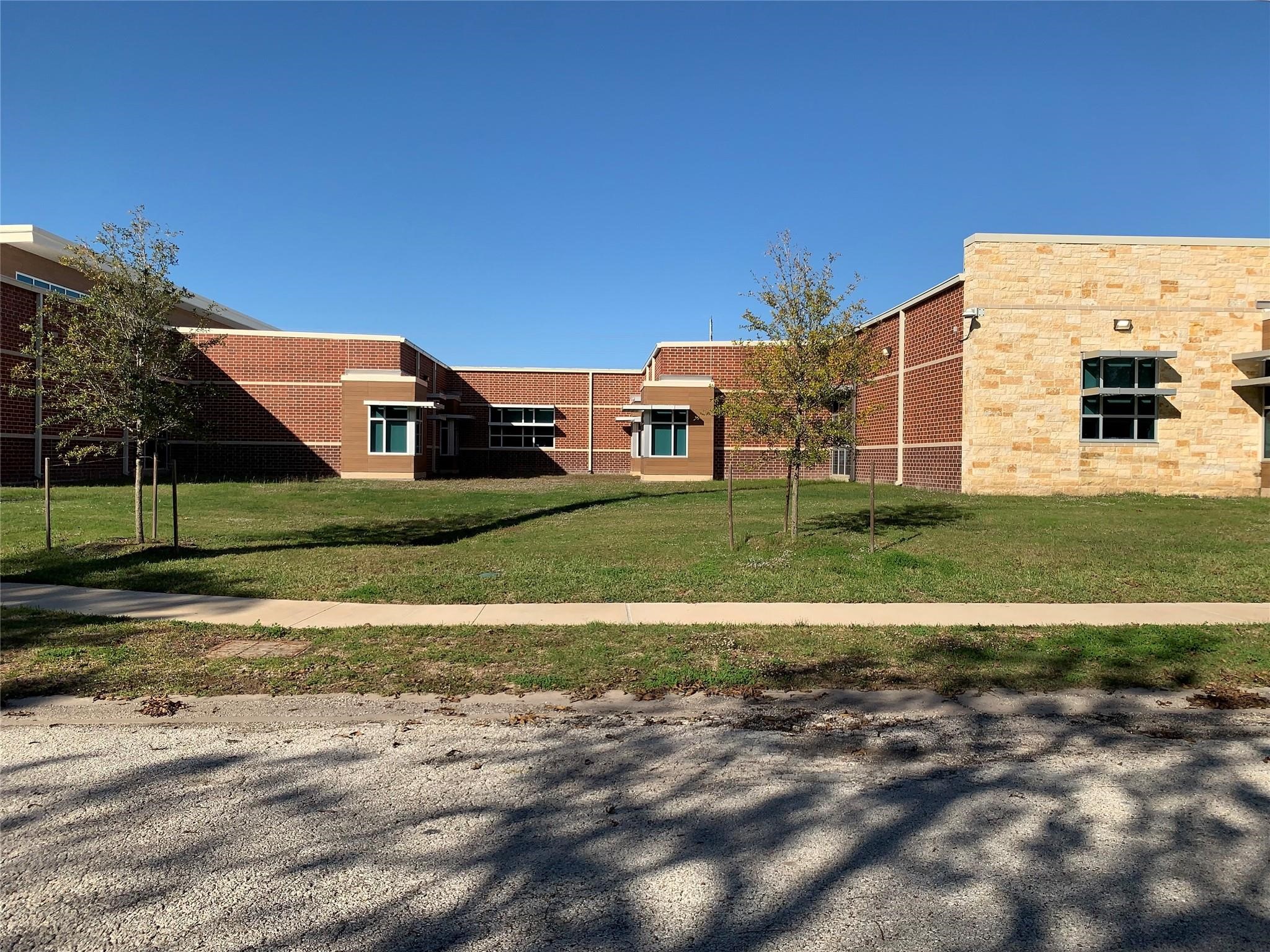 1819 Neuman La Marque, TX 77568 - Photo 6 of 8 Conveniently located directly across from Jimmy Haley Elementary School, this lot is ideal for families or anyone valuing proximity to educational facilities.