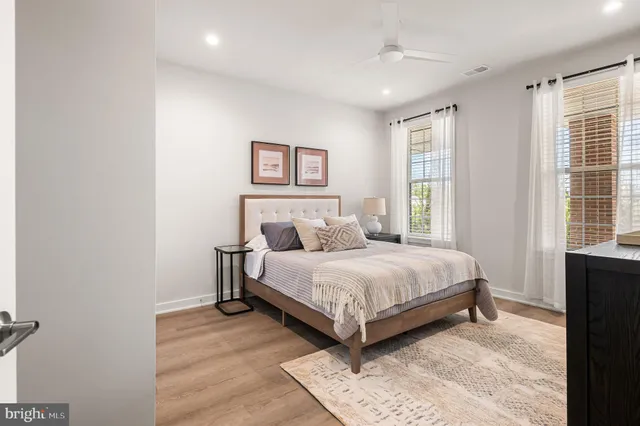 a bedroom with a bed and a lamp