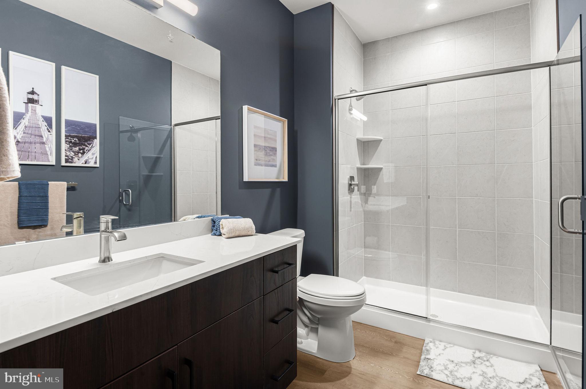 26 South York Road, Unit 101 Hatboro, PA 19040 - Photo 17 of 57 a bathroom with a sink toilet and shower