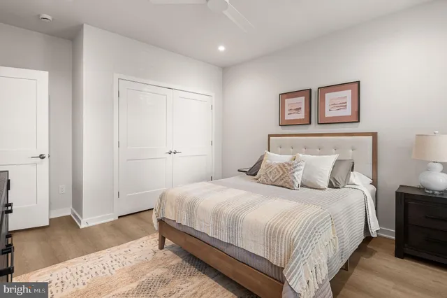 a bedroom with a bed and night stand