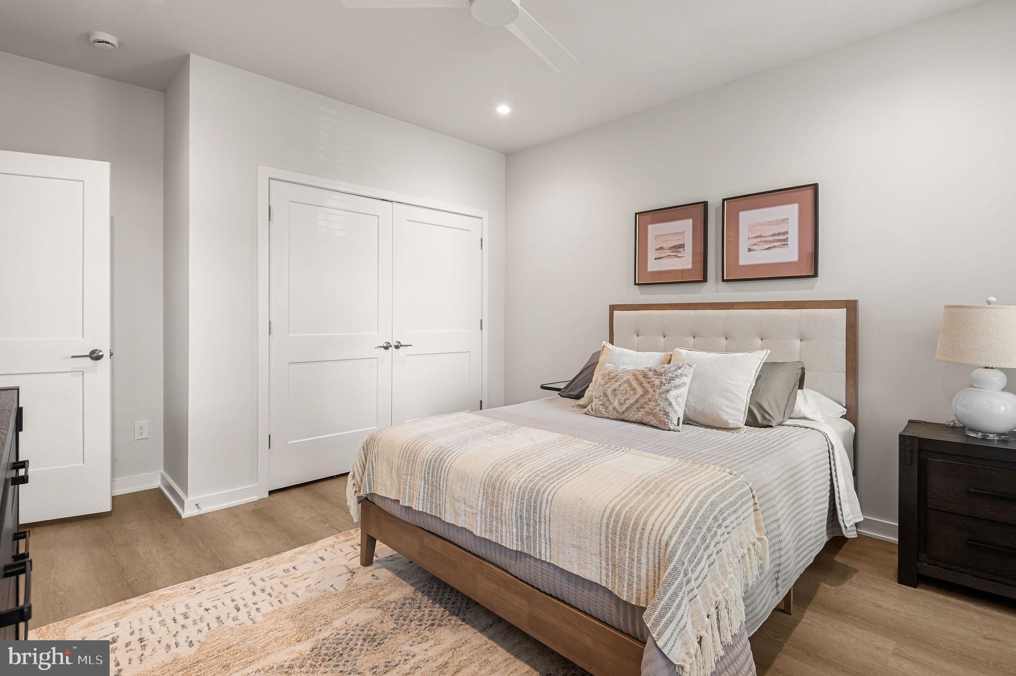 26 South York Road, Unit 101 Hatboro, PA 19040 - Photo 19 of 57 a bedroom with a bed and a lamp