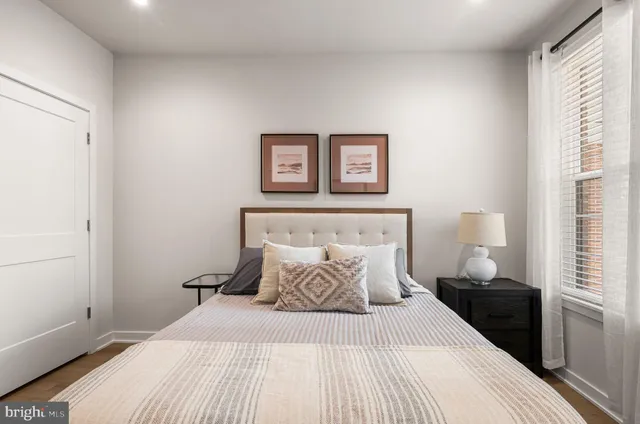 a bedroom with a bed and a dresser