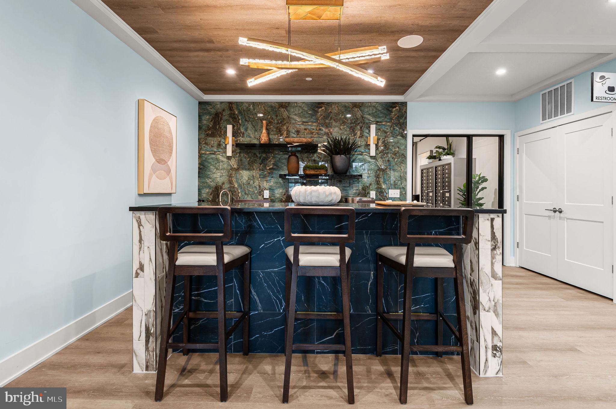 26 South York Road, Unit 101 Hatboro, PA 19040 - Photo 44 of 57 a kitchen with a table and chairs in it