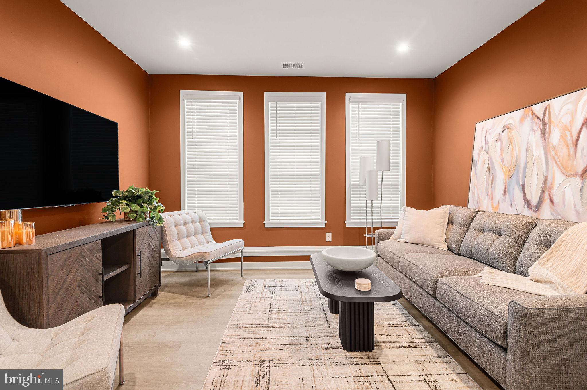26 South York Road, Unit 101 Hatboro, PA 19040 - Photo 10 of 56 a living room with furniture and a flat screen tv