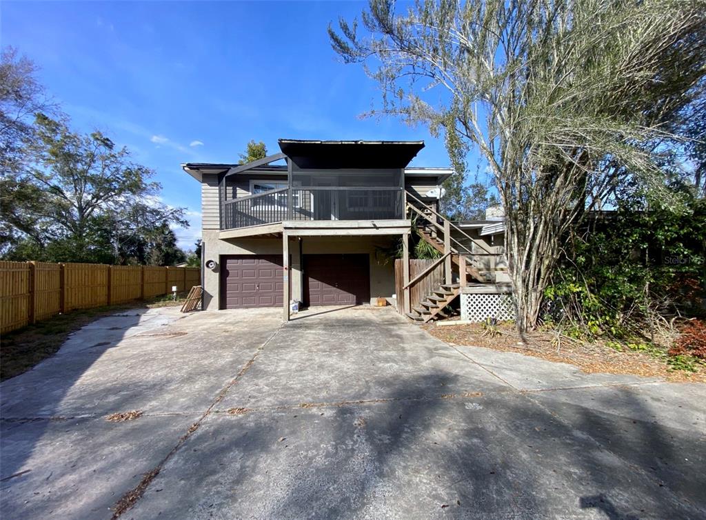 a view of a two chairs and a table in the patio