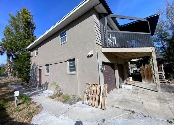a view of a patio with table and chairs and a fire pit