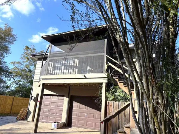 a view of a balcony with a tree