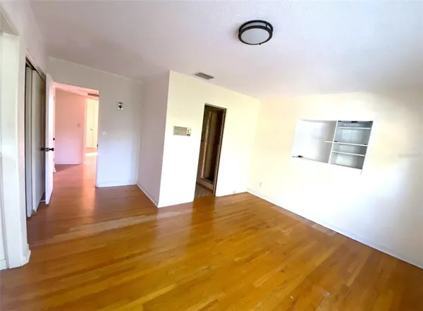 a view of a livingroom with wooden floor