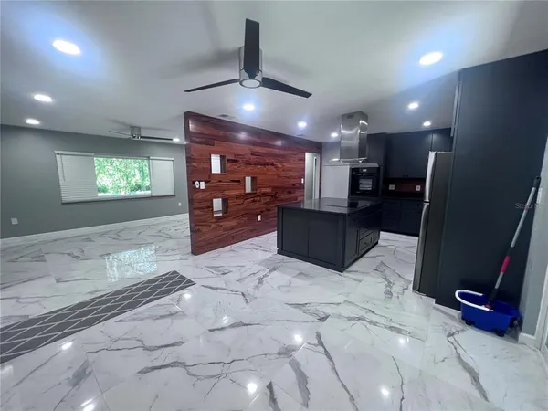 a room with a sink a washer and dryer