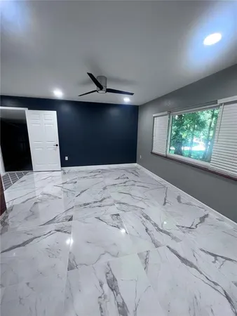 a kitchen with stainless steel appliances kitchen island granite countertop a sink and cabinets