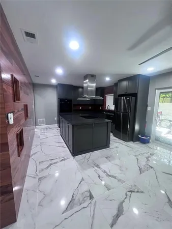 a view of a hall with a car park