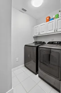 a utility room with cabinets