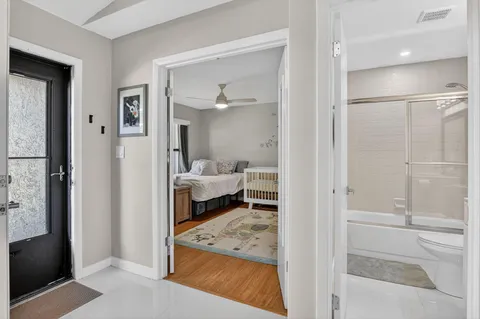 a view of a bathroom from a hallway