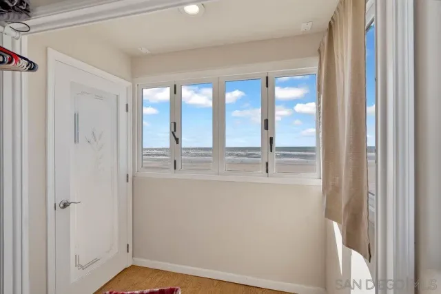 a balcony with table and chairs
