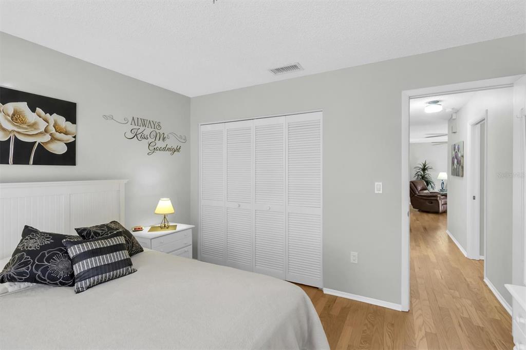 8141 Braddock Circle, Unit 3 Port Richey, FL 34668 - Photo 19 of 59 a bedroom with a bed and a couch