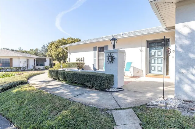 a view of a house with backyard and porch