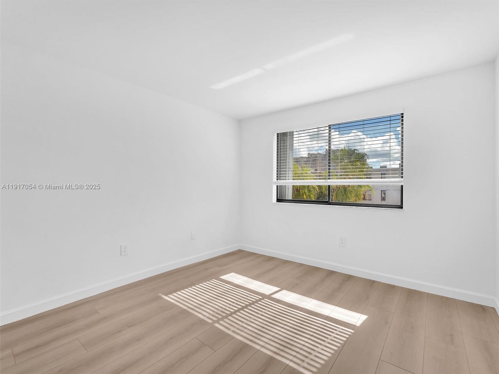 Key Biscayne Key Biscayne, FL 33149 - Photo 11 of 19 an empty room with wooden floor and windows