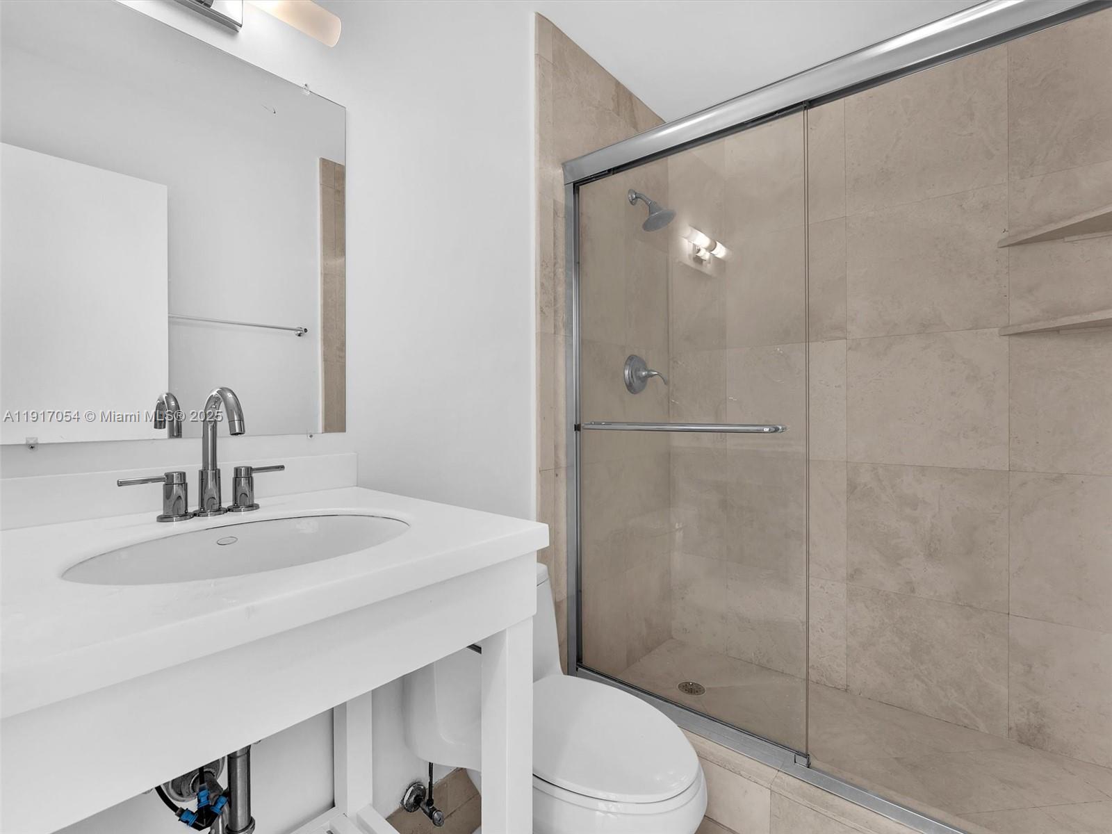 Key Biscayne Key Biscayne, FL 33149 - Photo 14 of 19 a bathroom with a sink toilet and shower