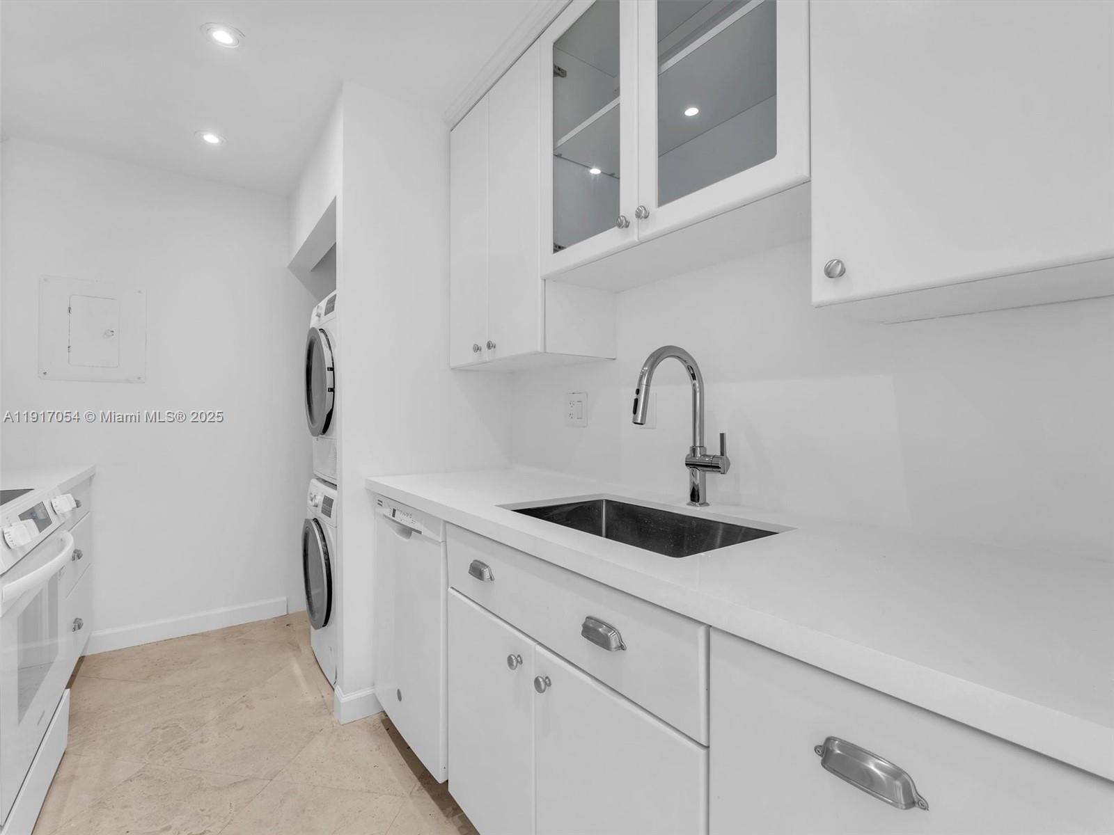 Key Biscayne Key Biscayne, FL 33149 - Photo 5 of 19 a kitchen with a sink and cabinets