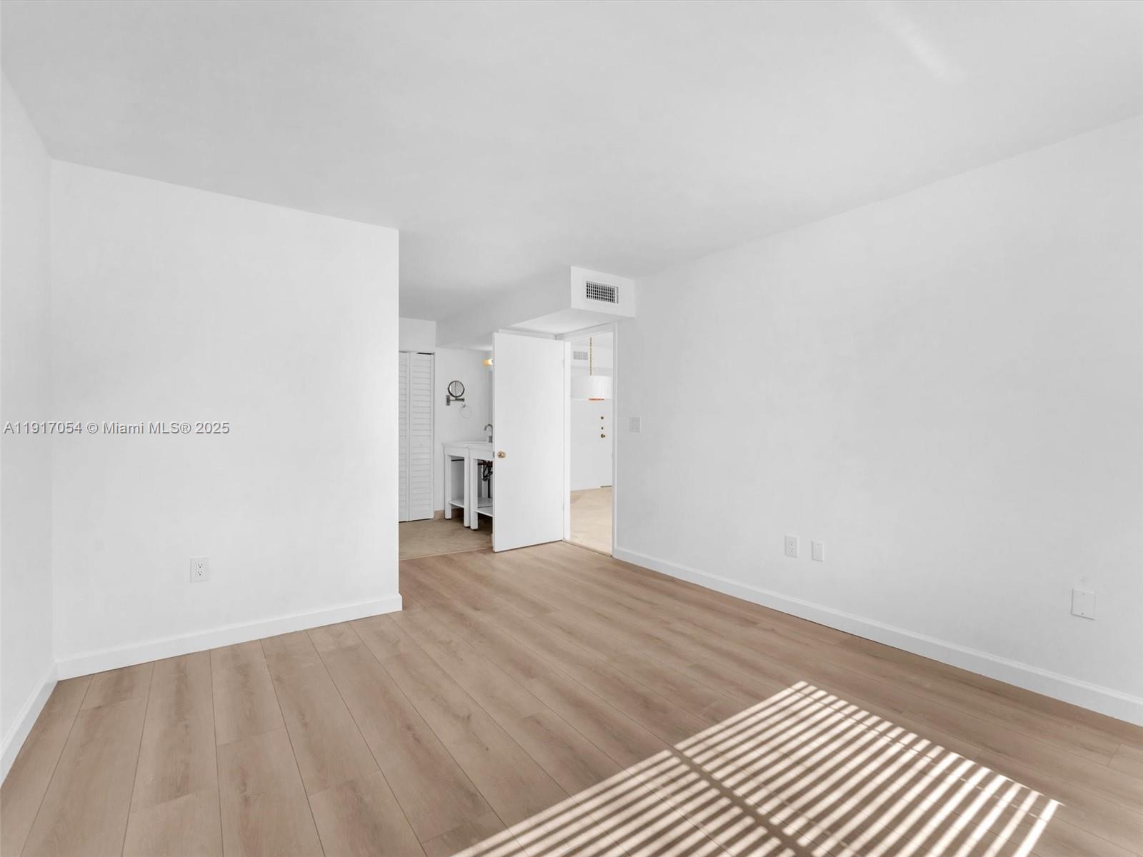 Key Biscayne Key Biscayne, FL 33149 - Photo 8 of 19 a view of an empty room and wooden floor