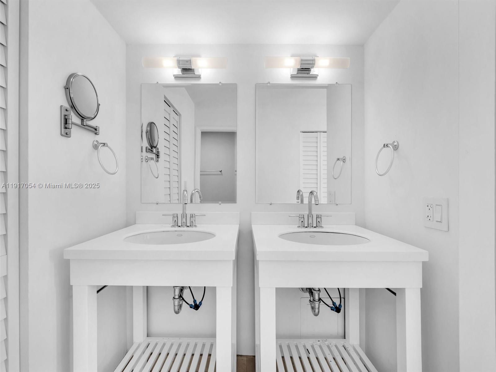 Key Biscayne Key Biscayne, FL 33149 - Photo 9 of 19 a bathroom with a sink and a mirror