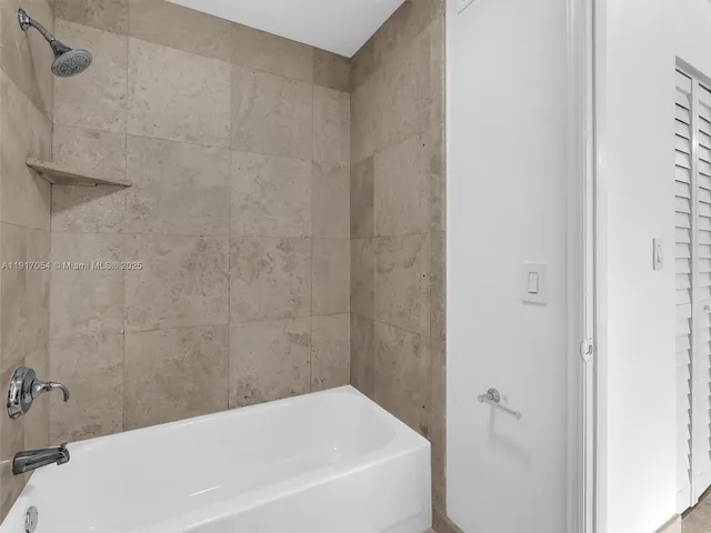 a bathroom with a white bath tub