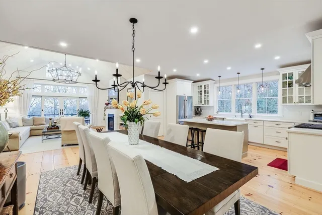 a large kitchen with a table and chairs