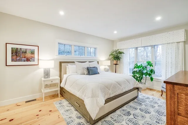 a bedroom with a bed and a flat screen television