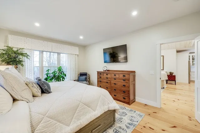 a bathroom with double vanity sinks and a shower