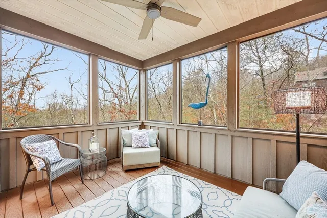 a kitchen with a table chairs refrigerator and window