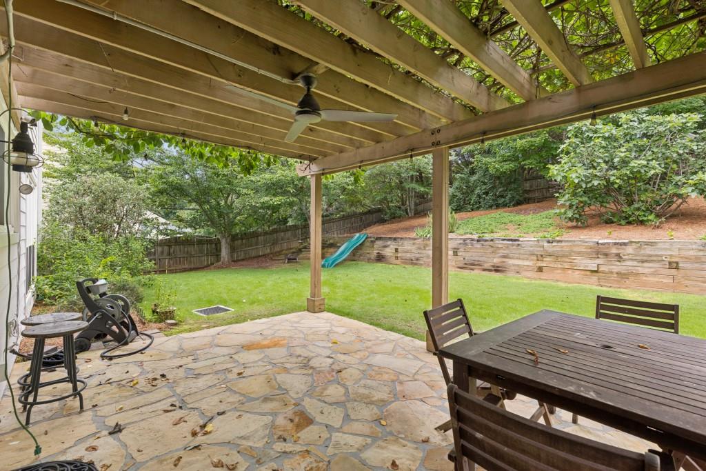 2120 Traywick Chase Alpharetta, GA 30004 - Photo 44 of 54 a view of a deck with a table chairs and a backyard