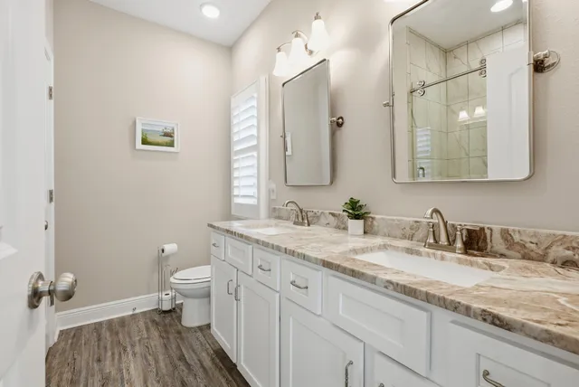 a bedroom with a bed and a television