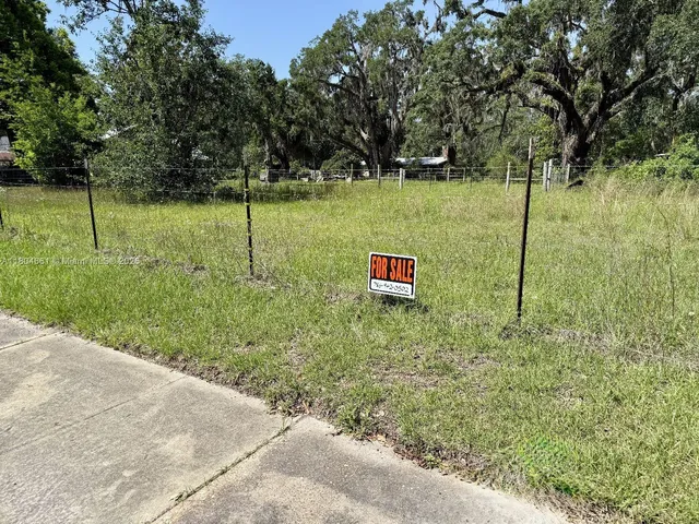 a view of a road with a yard
