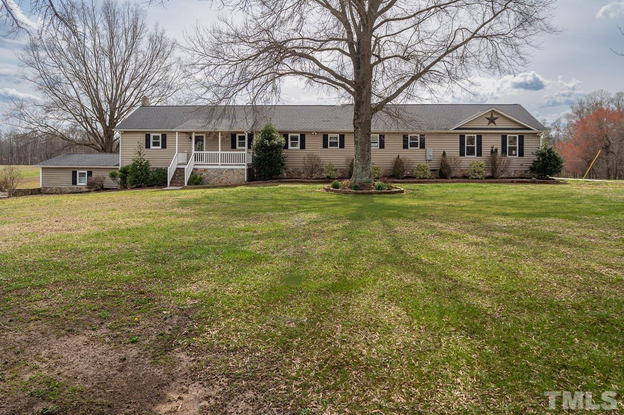 6668 Roby Coe Road Ramseur, NC 27316 - Photo 1 of 59 a front view of a house with a yard