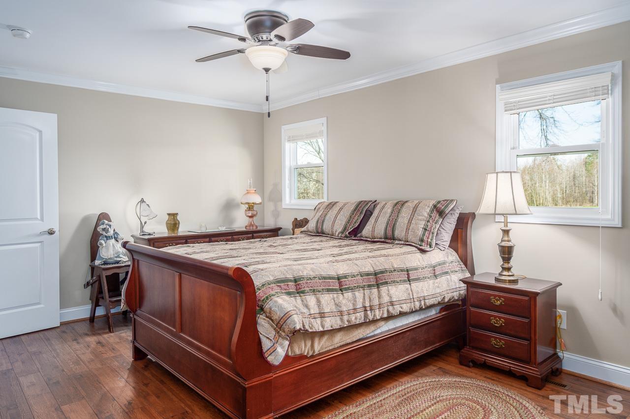 6668 Roby Coe Road Ramseur, NC 27316 - Photo 19 of 59 a bedroom with a bed and window