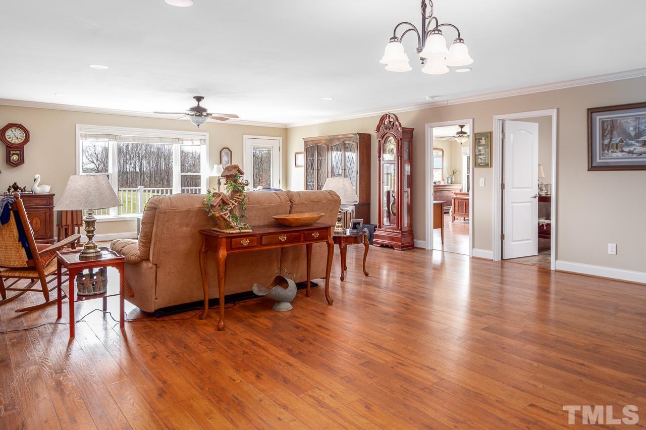 6668 Roby Coe Road Ramseur, NC 27316 - Photo 24 of 59 a view of a livingroom with furniture window and wooden floor