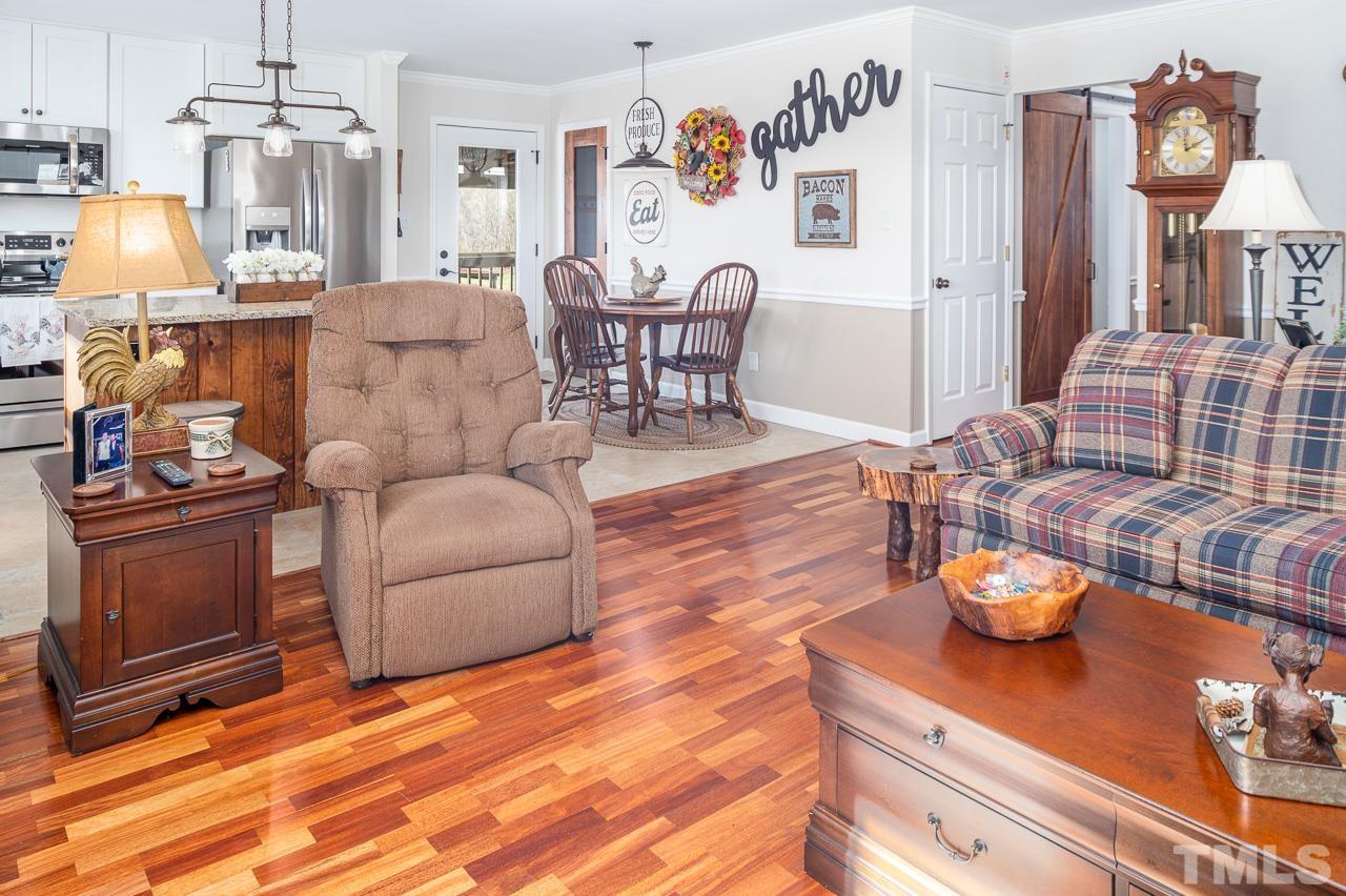 6668 Roby Coe Road Ramseur, NC 27316 - Photo 3 of 59 a living room with furniture and wooden floor